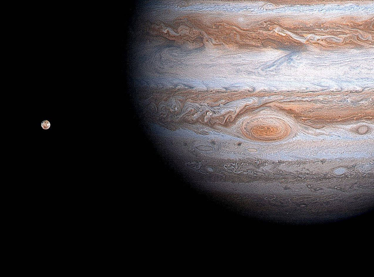 1274x945 Download Jupiter And Its Moon Wallpaper | Wallpapers.com Wallpaper