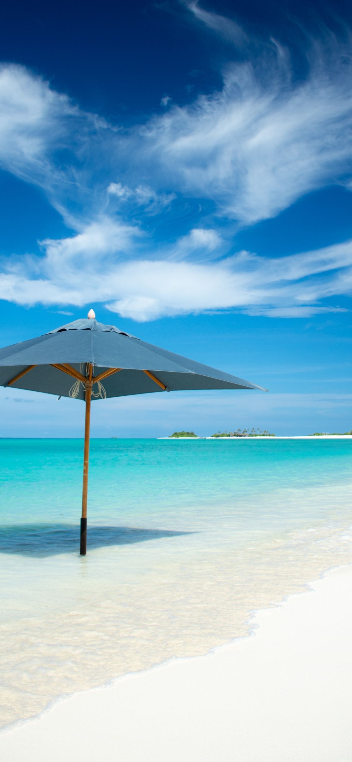 1125x2436 Download 1125x2436 wallpaper umbrella, beach, tropical island ... Wallpaper