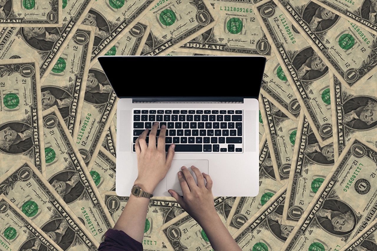 1280x853 image Laptops Dollars Paper money Business Clock Hands Money on Wa...